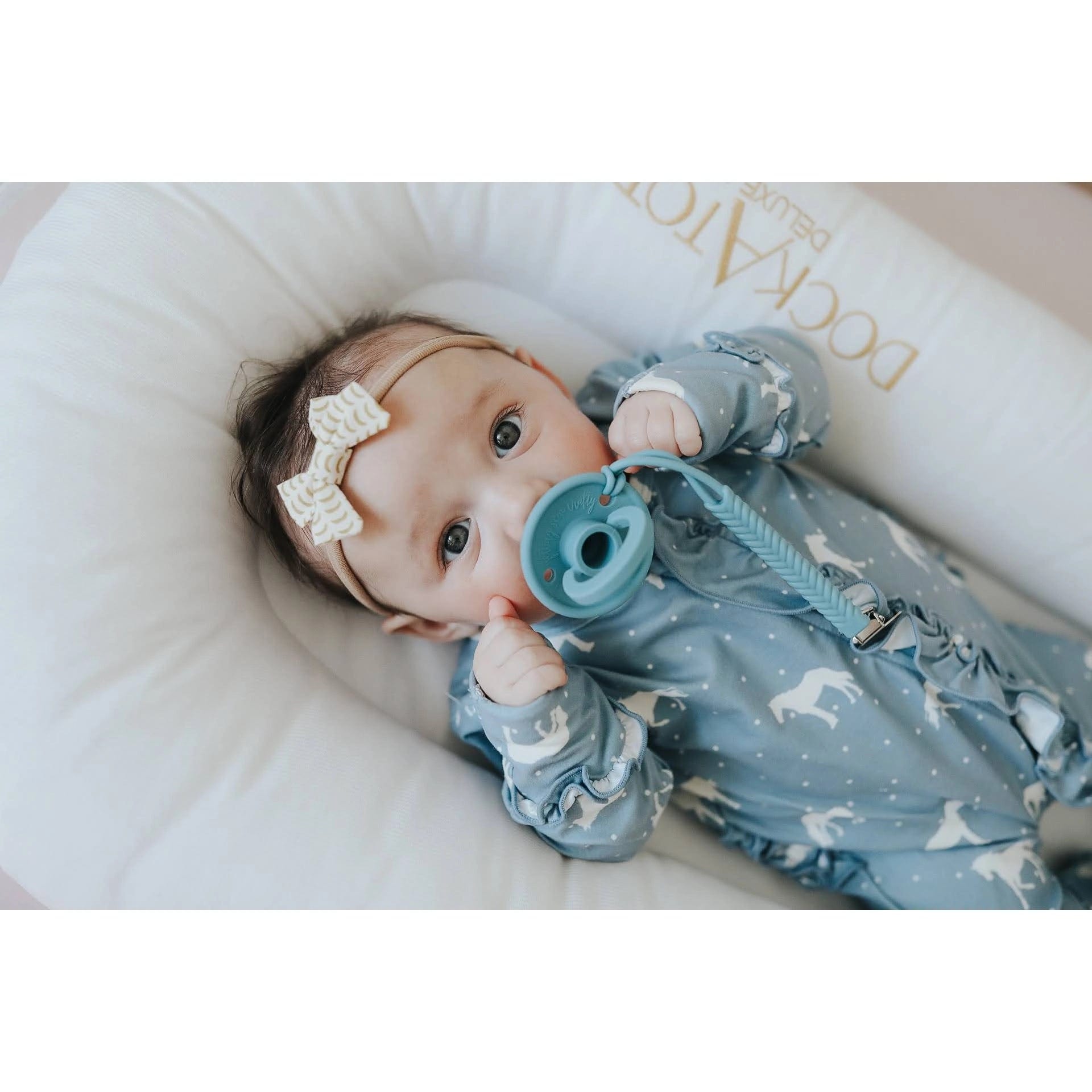 Oli pacifier sales